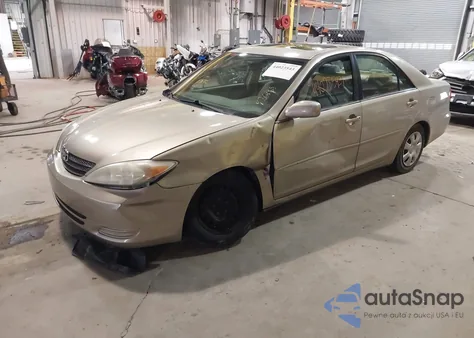 2002 Toyota Camry Le z USA, uszkodzony, nr VIN 4T1BE32K22U581499